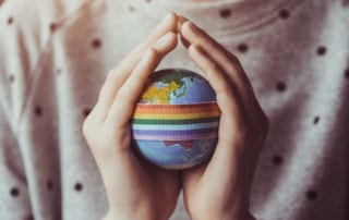 Work Abroad. A person holding a globe