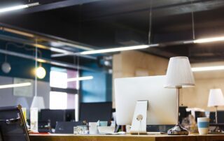 Skills Gap - an office desk with a computer, lamp and mugs